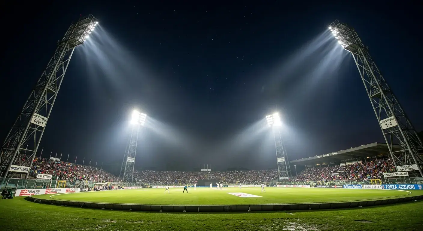 Stadio di cricket illuminato dai riflettori durante una partita notturna